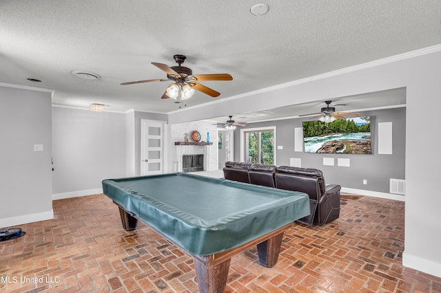 rec room with ornamental molding, a textured ceiling, billiards, and ceiling fan