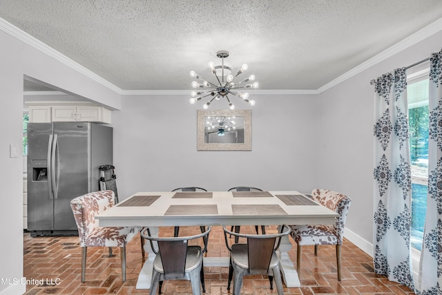 dining space with a textured ceiling, an inviting chandelier, and ornamental molding