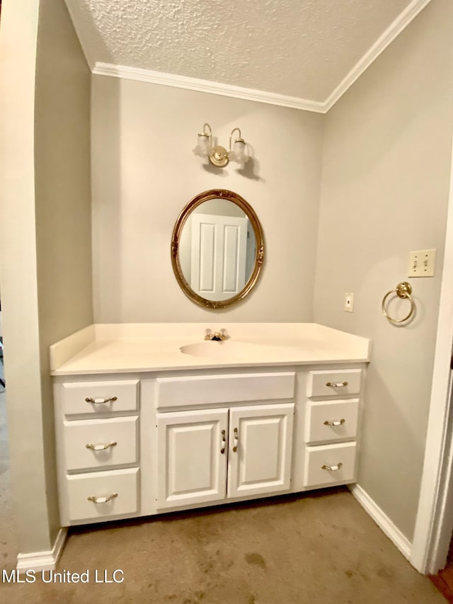 bathroom featuring a textured ceiling, baseboards, vanity, and crown molding