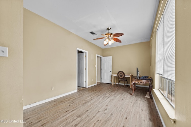 224 Clarence Ave, Pass Christian, MS 39571 - sitting room with wood finished floors, ceiling fan, and baseboards