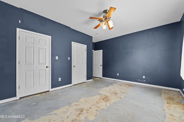 224 Clarence Ave, Pass Christian, MS 39571 - unfurnished bedroom with concrete floors, baseboards, and ceiling fan