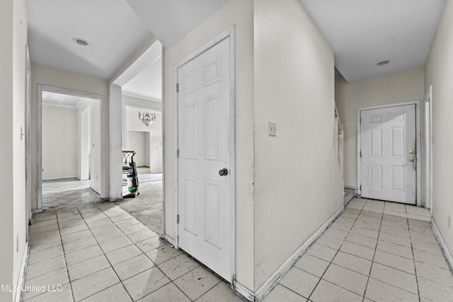 224 Clarence Ave, Pass Christian, MS 39571 - hallway featuring light tile patterned floors and baseboards