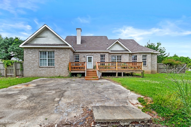 224 Clarence Ave, Pass Christian, MS 39571 - rear view of property featuring brick siding, a chimney, a wooden deck, and a shingled roof