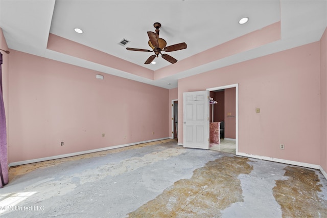 224 Clarence Ave, Pass Christian, MS 39571 - empty room featuring a raised ceiling, baseboards, ceiling fan, recessed lighting, and concrete floors