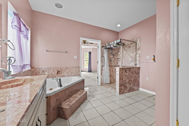 224 Clarence Ave, Pass Christian, MS 39571 - bathroom featuring walk in shower, a garden tub, tile patterned floors, vanity, and a ceiling fan