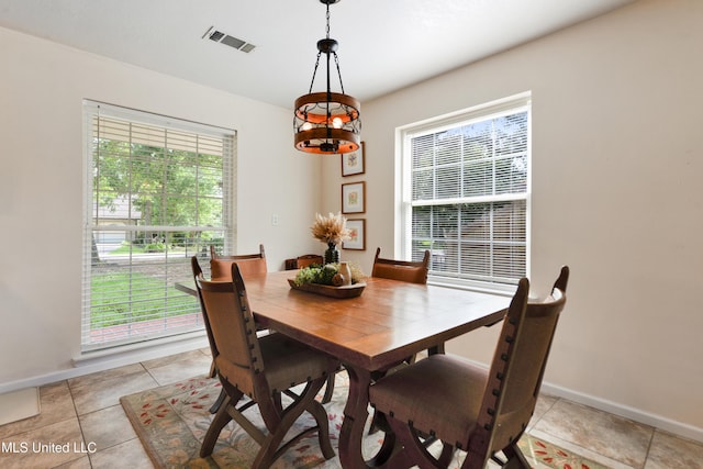 2508 Orrell Dr, Gautier, MS 39553 - dining space featuring plenty of natural light, baseboards, and light tile patterned floors