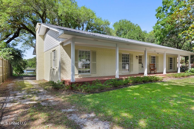 2508 Orrell Dr, Gautier, MS 39553 - view of front of home featuring brick siding, a front lawn, and a porch