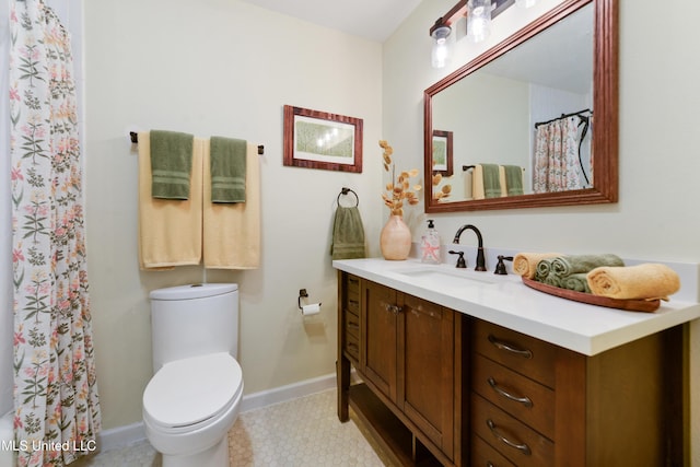 2508 Orrell Dr, Gautier, MS 39553 - bathroom with vanity, toilet, baseboards, a shower with curtain, and tile patterned floors