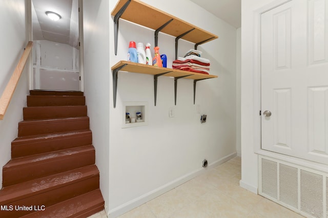2508 Orrell Dr, Gautier, MS 39553 - washroom featuring washer hookup, electric dryer hookup, baseboards, and light tile patterned flooring