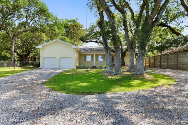 2508 Orrell Dr, Gautier, MS 39553 - ranch-style home featuring gravel driveway and an attached garage