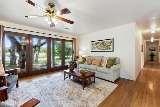 2508 Orrell Dr, Gautier, MS 39553 - living area with a ceiling fan, baseboards, and hardwood / wood-style flooring