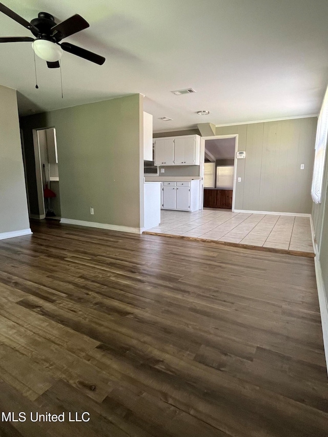 unfurnished living room with light wood-type flooring and ceiling fan