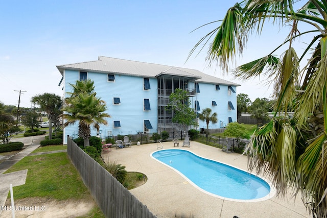 view of pool featuring a patio