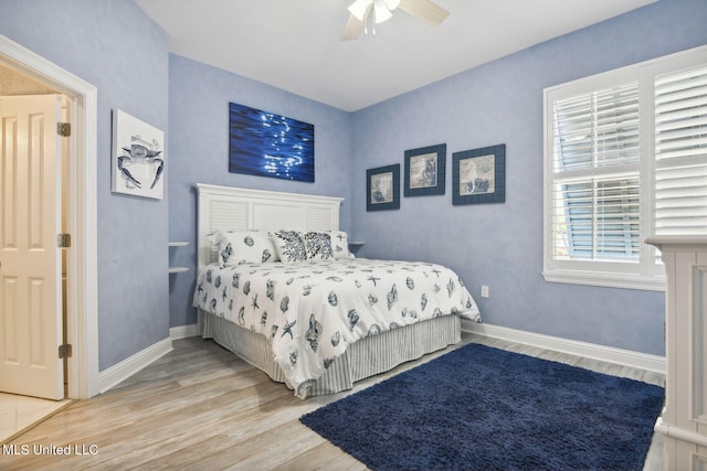 bedroom featuring ceiling fan and hardwood / wood-style flooring