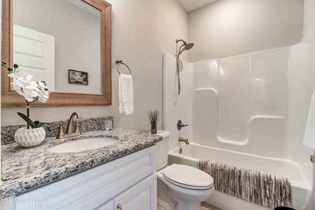 full bathroom featuring shower / washtub combination, toilet, and vanity