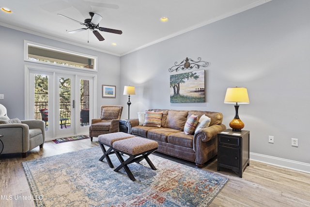 living room with wood-type flooring, ceiling fan, and crown molding