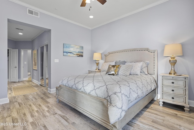 bedroom with ceiling fan, ornamental molding, connected bathroom, light hardwood / wood-style floors, and a closet