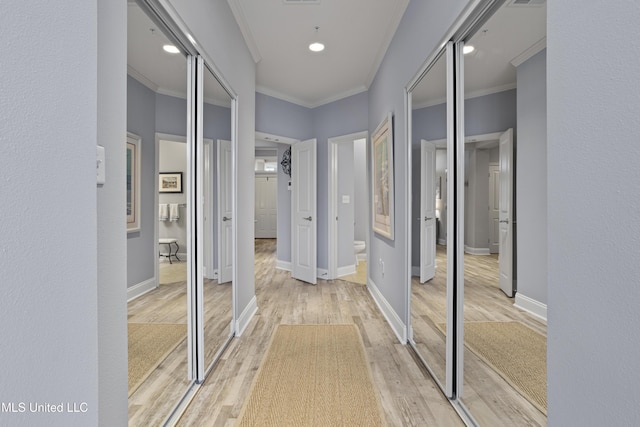 corridor featuring hardwood / wood-style flooring and crown molding