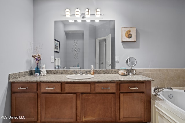 bathroom featuring a washtub, toilet, and vanity