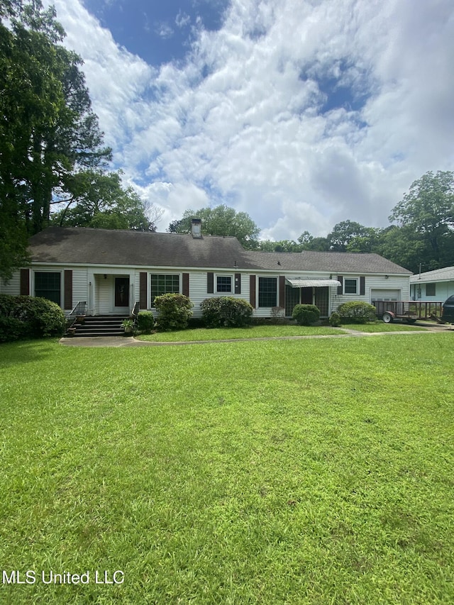 210 Colonial Cir, Jackson, MS 39211 - ranch-style home featuring an attached garage and a front yard