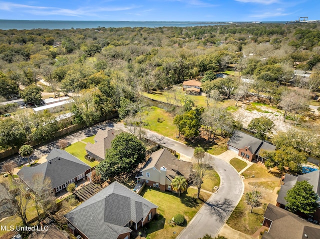 aerial view featuring a view of trees and a residential view