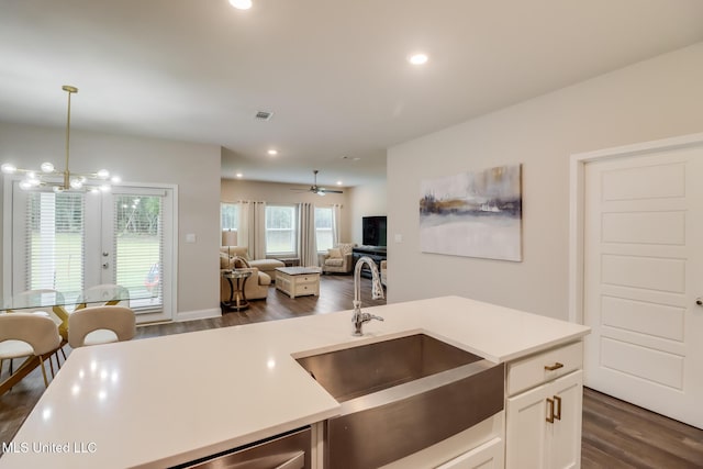 87139 Highpoint Dr, Diamondhead, MS 39525 - kitchen featuring open floor plan, dark wood-style floors, light countertops, pendant lighting, and recessed lighting