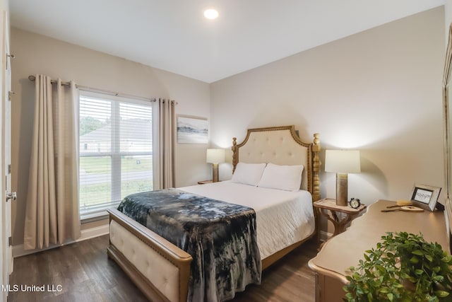 87139 Highpoint Dr, Diamondhead, MS 39525 - bedroom with multiple windows and dark wood-style flooring