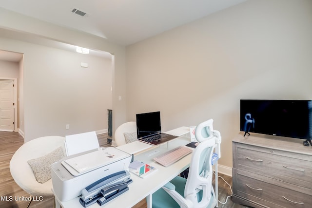 87139 Highpoint Dr, Diamondhead, MS 39525 - home office featuring wood finished floors and baseboards