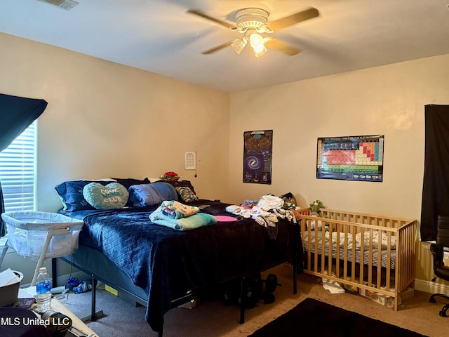 6088 E Hinds St, Bay Saint Louis, MS 39520 - carpeted bedroom with ceiling fan