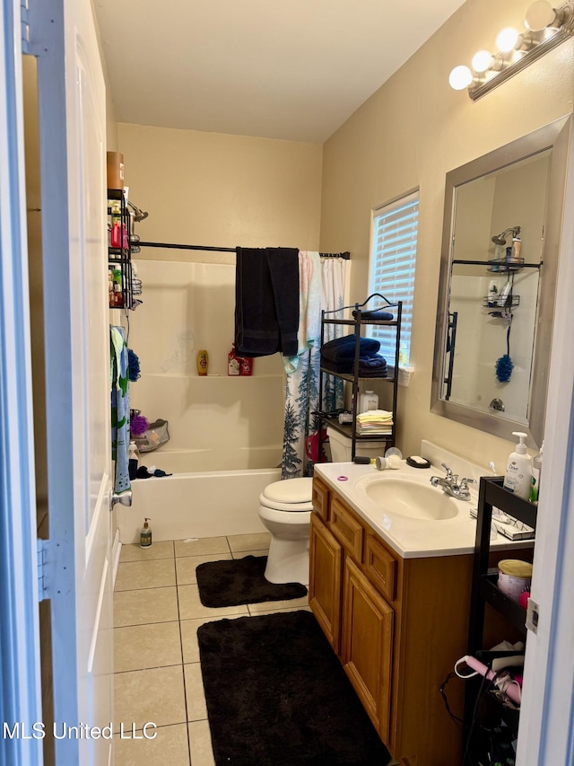 6088 E Hinds St, Bay Saint Louis, MS 39520 - bathroom featuring tile patterned floors, vanity, and shower / tub combo