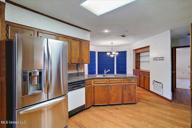 kitchen featuring sink, dishwasher, hanging light fixtures, light hardwood / wood-style floors, and stainless steel fridge with ice dispenser