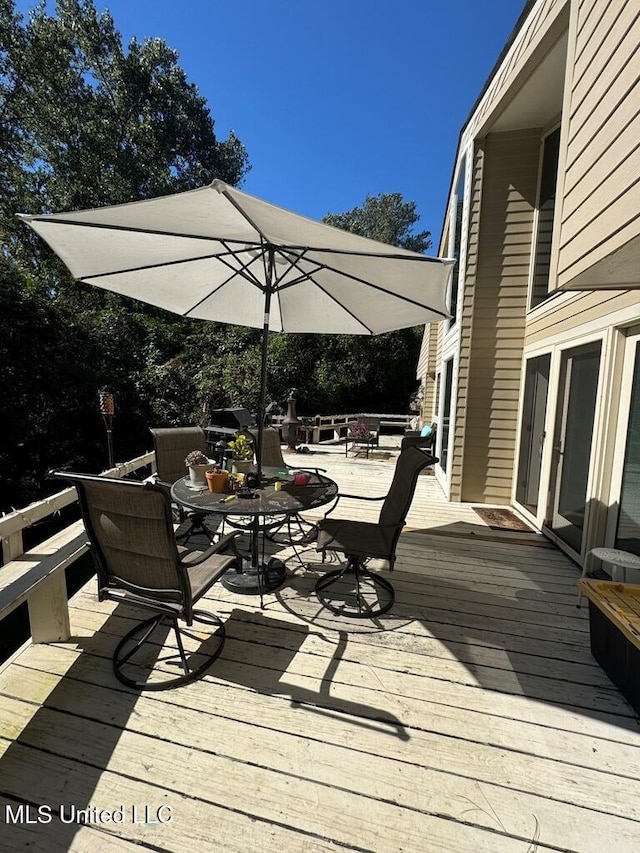 deck featuring a fire pit