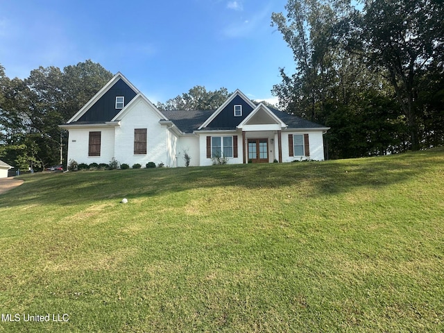 view of front of property featuring french doors and a front yard