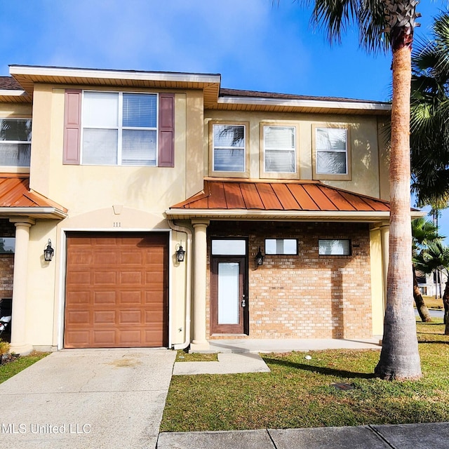 view of front of home with a garage