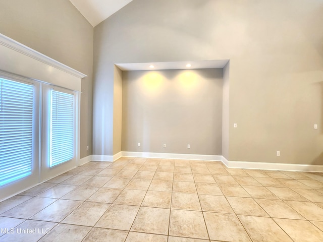 tiled empty room with high vaulted ceiling