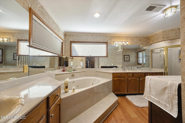 bathroom with separate shower and tub, hardwood / wood-style flooring, vanity, and ornamental molding