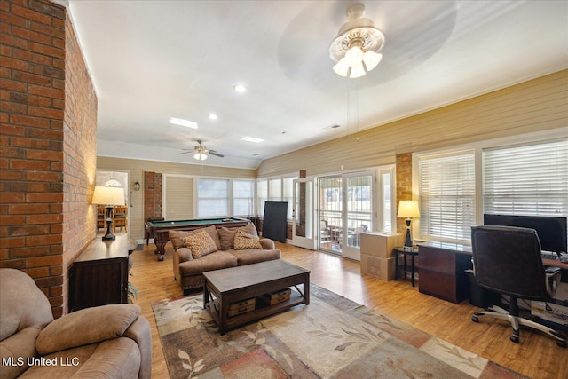 living room with ceiling fan, light hardwood / wood-style floors, and pool table