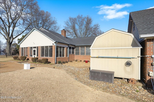 view of front of home featuring a sunroom