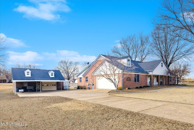 view of front of property with a carport, a garage, and a front yard