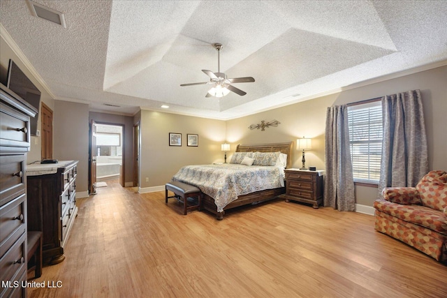 bedroom with a raised ceiling, ceiling fan, light hardwood / wood-style flooring, and ornamental molding