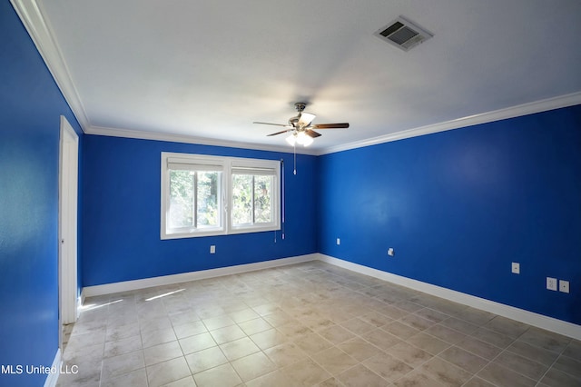 tiled empty room featuring ceiling fan and ornamental molding