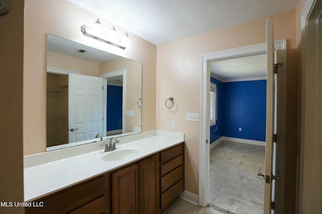 63720 N Diamondhead Dr, Diamondhead, MS 39525 - bathroom featuring vanity, tile patterned flooring, and baseboards