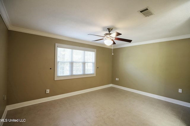 spare room featuring ornamental molding and ceiling fan