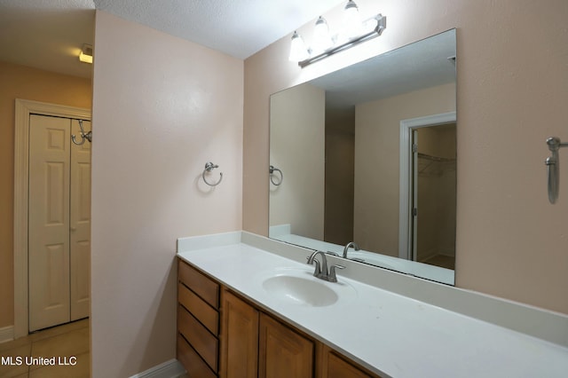 bathroom featuring tile patterned floors and vanity