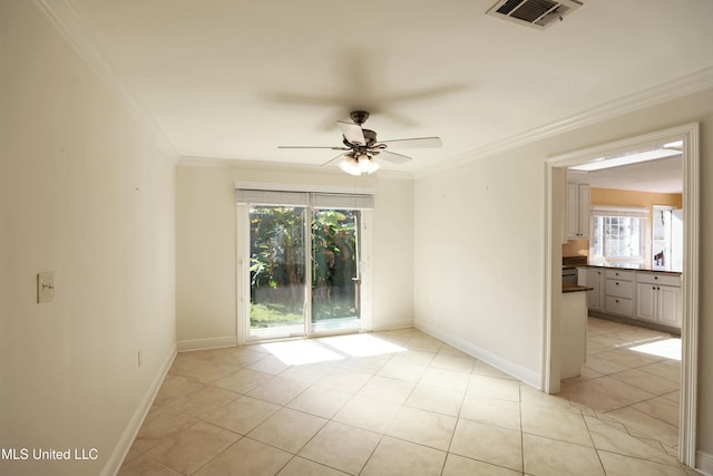 63720 N Diamondhead Dr, Diamondhead, MS 39525 - empty room with plenty of natural light, ornamental molding, a ceiling fan, light tile patterned flooring, and baseboards
