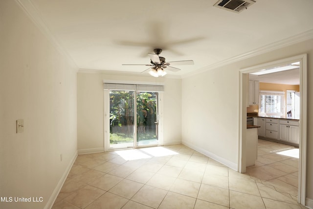 empty room featuring ornamental molding, light tile patterned flooring, and ceiling fan