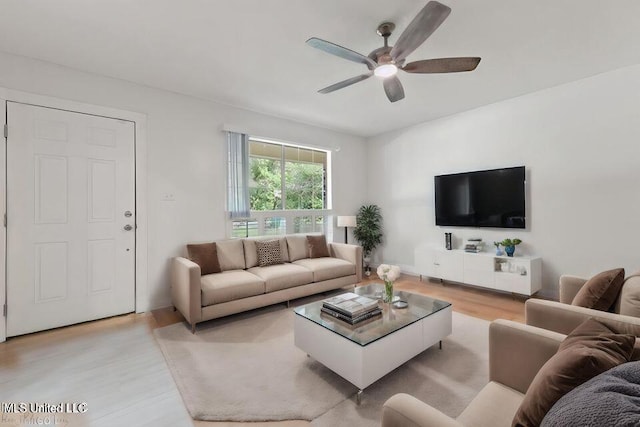 living area featuring ceiling fan and light wood-type flooring