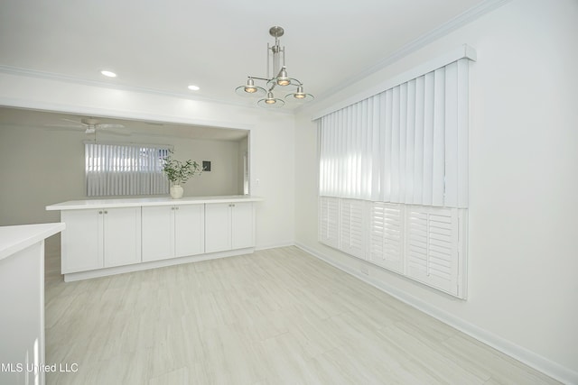 spare room featuring baseboards, recessed lighting, a ceiling fan, and crown molding