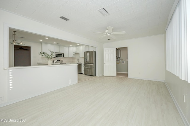 unfurnished living room featuring ceiling fan, light wood-type flooring, visible vents, and baseboards