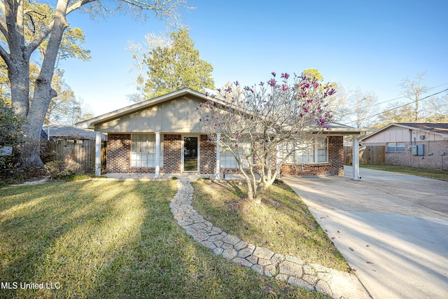 single story home featuring brick siding, a front lawn, and fence